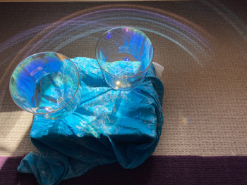 Crystal bowls with a drum in the background.