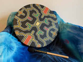 A drum on a azure blanket.